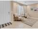 Inviting living area featuring neutral tones, tile flooring, and comfortable seating at 10135 Haymarket Peak Ave, Las Vegas, NV 89166