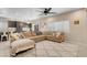 Comfortable living room with a cozy sofa, decorative pillows, and a plush rug with a large window at 10135 Haymarket Peak Ave, Las Vegas, NV 89166