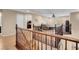 Second floor loft space, hardwood floors, with railing overlooking the entry and rooms on either side at 10135 Haymarket Peak Ave, Las Vegas, NV 89166