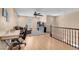 Loft space perfect for an office or play area with hardwood floors, ceiling fan and view of stairs at 10135 Haymarket Peak Ave, Las Vegas, NV 89166