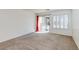 Bright bedroom features neutral carpet, and a sliding door to the pool area with plantation shutters at 10241 Headrick Dr, Las Vegas, NV 89166