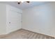 This is a bedroom with carpet and a ceiling fan and a closet with a double door at 10241 Headrick Dr, Las Vegas, NV 89166