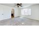 The bedroom features carpet and a large window with plantation shutters for privacy at 10241 Headrick Dr, Las Vegas, NV 89166