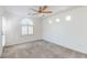 Neutral bedroom features a ceiling fan and window with shutters at 10241 Headrick Dr, Las Vegas, NV 89166