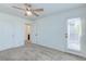 Bedroom with a ceiling fan, door and hallway access at 10241 Headrick Dr, Las Vegas, NV 89166