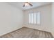 Bedroom with fresh paint, carpet, window shutters, and ceiling fan at 10241 Headrick Dr, Las Vegas, NV 89166