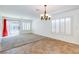 Dining area with tile flooring, plantation shutters, access to the pool, and modern light fixture at 10241 Headrick Dr, Las Vegas, NV 89166
