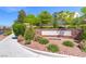 Entrance to Madison Colony at Providence with lush landscaping at 10241 Headrick Dr, Las Vegas, NV 89166