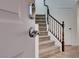 Inviting entryway with modern door lock, open door and staircase leading to upper level at 10241 Headrick Dr, Las Vegas, NV 89166