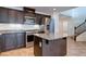 Well-equipped kitchen features dark cabinets, stainless steel appliances, and granite countertops at 10241 Headrick Dr, Las Vegas, NV 89166