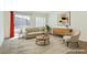 Bright living area with sliding glass doors and sleek modern furniture for a comfortable space at 10241 Headrick Dr, Las Vegas, NV 89166