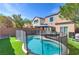 Backyard featuring an in-ground pool, gazebo and landscaped yard at 10241 Headrick Dr, Las Vegas, NV 89166