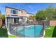 A backyard features a gazebo and a refreshing in-ground swimming pool at 10241 Headrick Dr, Las Vegas, NV 89166