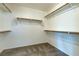 Spacious walk-in closet featuring built-in shelving and ample storage space at 10241 Headrick Dr, Las Vegas, NV 89166