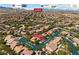 Aerial view of a neighborhood and surrounding amenities showing parks and nearby attractions at 10281 Wolves Den Ln, Las Vegas, NV 89178