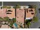 Top-down aerial of backyard showcasing a pool, patio, grass, and tidy landscaping at 10281 Wolves Den Ln, Las Vegas, NV 89178