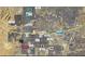 High angle aerial view of a neighborhood and surrounding amenities with local restaurants and shops at 10281 Wolves Den Ln, Las Vegas, NV 89178