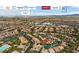 Aerial view of a neighborhood and the surrounding area showing nearby parks and roadways at 10281 Wolves Den Ln, Las Vegas, NV 89178