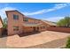 Home with large stamped concrete patio, well-maintained landscaping, and outdoor living at 10281 Wolves Den Ln, Las Vegas, NV 89178