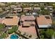 Aerial view of a home's backyard with a pool, and patio perfect for entertaining Gathering and friends at 10281 Wolves Den Ln, Las Vegas, NV 89178