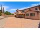 Large stamped concrete backyard patio offers plenty of outdoor living space at 10281 Wolves Den Ln, Las Vegas, NV 89178