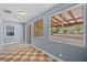 Bonus room featuring tile flooring, multiple windows and a sliding door access to the outside patio at 10281 Wolves Den Ln, Las Vegas, NV 89178