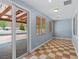 Bonus room with checkered tile flooring, multiple windows and direct access to the backyard at 10281 Wolves Den Ln, Las Vegas, NV 89178