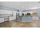 Spacious kitchen featuring white cabinets, stainless appliances, and a large island at 10281 Wolves Den Ln, Las Vegas, NV 89178