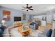 Cozy living room area with a seamless transition to the open-concept kitchen at 10281 Wolves Den Ln, Las Vegas, NV 89178