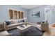 Bright living room with a comfortable couch, stylish decor, and natural light at 10281 Wolves Den Ln, Las Vegas, NV 89178