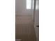 The bedroom features neutral walls, carpeted floors, and bright, natural light from one large window at 10282 Keystone Pastures St, Las Vegas, NV 89183