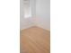 Bedroom with wooden floors, window, and small base board trims at 10282 Keystone Pastures St, Las Vegas, NV 89183