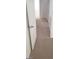 This is a view of the hallway with white doors and neutral carpeting at 10282 Keystone Pastures St, Las Vegas, NV 89183