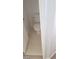 Small bathroom toilet in a small room and closed off with a door at 10282 Keystone Pastures St, Las Vegas, NV 89183