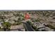 An aerial view of a house with a well-kept lawn and beautiful surrounding landscape at 10309 Canyon Valley Ave, Las Vegas, NV 89145