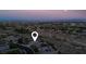 A tranquil aerial view showcases city lights and surrounding landscape with mountain views at 10309 Canyon Valley Ave, Las Vegas, NV 89145