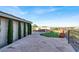 Expansive backyard showcasing a patio, pool, putting green, and manicured trees at 10309 Canyon Valley Ave, Las Vegas, NV 89145