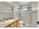 Bathroom featuring granite countertop, shower, and decorative tile at 10309 Canyon Valley Ave, Las Vegas, NV 89145