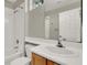 Bathroom featuring a single sink vanity and a shower and tub combo at 10309 Canyon Valley Ave, Las Vegas, NV 89145