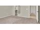 Bedroom with neutral carpeting showing closet and adjacent hallway at 10309 Canyon Valley Ave, Las Vegas, NV 89145