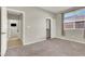 Bedroom has carpeted floors, a window, and an adjoining bathroom at 10309 Canyon Valley Ave, Las Vegas, NV 89145