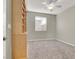 Well-lit bedroom with a built-in bookcase and soft carpet flooring, complemented by natural light at 10309 Canyon Valley Ave, Las Vegas, NV 89145