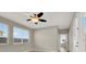Bright bedroom with ceiling fan and multiple windows with blinds at 10309 Canyon Valley Ave, Las Vegas, NV 89145