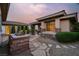 Exterior view of landscaped backyard with built-in grill and stone pavers at 10309 Canyon Valley Ave, Las Vegas, NV 89145
