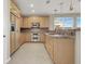 Bright kitchen featuring wood cabinets, stainless steel appliances, and granite countertops at 10309 Canyon Valley Ave, Las Vegas, NV 89145