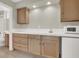 Living room features a sink, microwave, built in cabinets and drawers at 10309 Canyon Valley Ave, Las Vegas, NV 89145