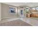 Large living room with tile flooring, built-in cabinetry, and access to backyard at 10309 Canyon Valley Ave, Las Vegas, NV 89145