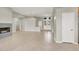Open-concept living room with fireplace, tile flooring, and lots of natural light at 10309 Canyon Valley Ave, Las Vegas, NV 89145