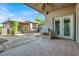 Exterior view of the outdoor patio with built-in grill and tiled flooring at 10309 Canyon Valley Ave, Las Vegas, NV 89145