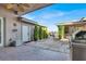 Wide patio with barbeque, decorative plants, pavers and privacy wall at 10309 Canyon Valley Ave, Las Vegas, NV 89145